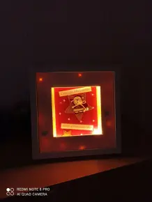Selbst gestalteter Bilderrahmen als Mitbringsel in der Adventszeit