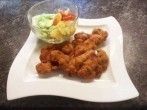 Ausgel&ouml;ste H&uuml;hnerkeulen paniert und frittiert