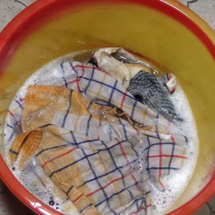 Kettenschmiere aus Wäsche entfernen