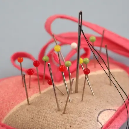 Abgerissener Knopf schnell angenäht