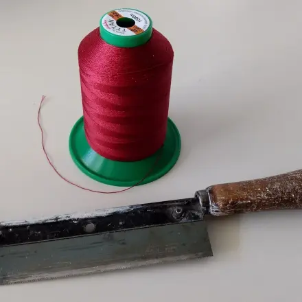 Garn-Konen: Fadenende sichern