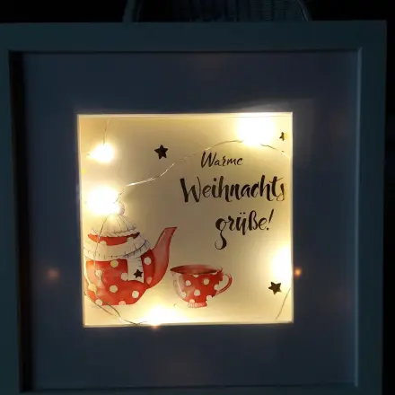 Selbst gestalteter Bilderrahmen als Mitbringsel in der Adventszeit